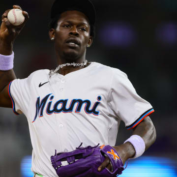 May 20, 2024; Miami, Florida, USA; Miami Marlins center fielder Jazz Chisholm Jr. (2) tosses a baseball to the fans in the tenth inning against the Milwaukee Brewers at loanDepot Park.