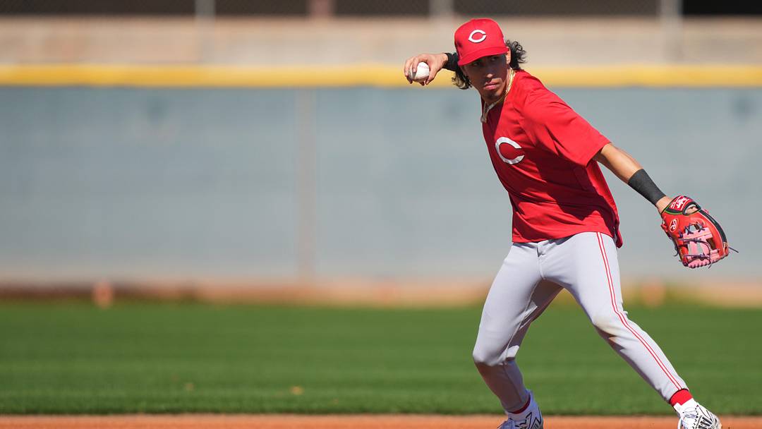 Feb 21, 2024; Goodyear, AZ, USA; Cincinnati Reds reds non-roster invitee infielder Edwin Arroyo throws to first base during fielding drills at spring training workouts at Goodyear Ballpark. Mandatory Credit: Kareem Elgazzar-Imagn Images Feb 21, 2024; Goodyear, AZ, USA; Cincinnati Reds reds non-roster invitee infielder Edwin Arroyo throws to first base during fielding drills at spring training workouts at Goodyear Ballpark. Mandatory Credit: Kareem Elgazzar-Imagn Images