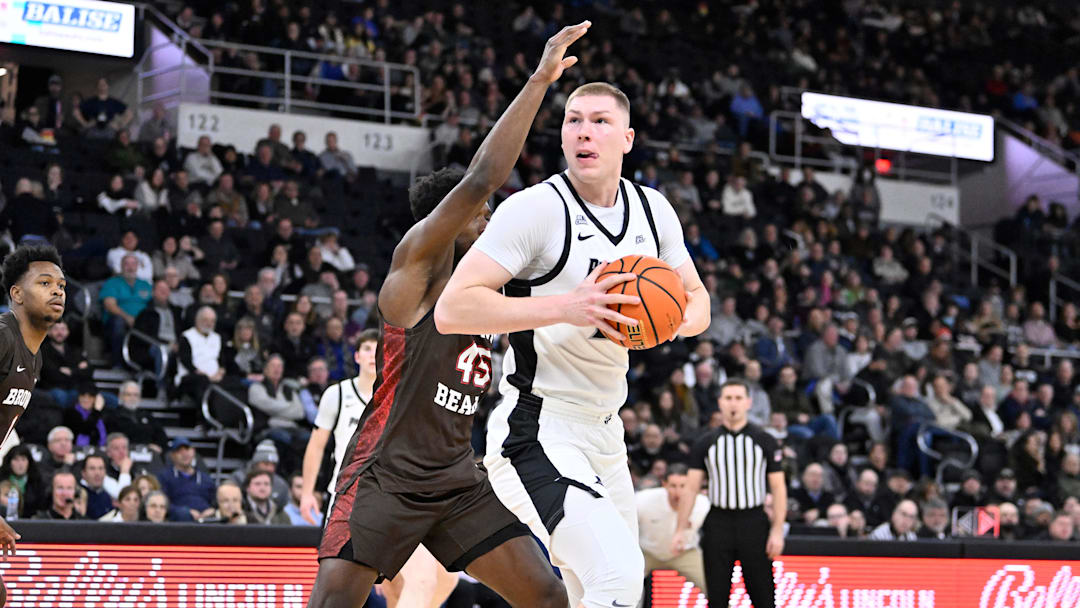 Dec 9, 2025; Providence, Rhode Island, USA; Providence Friars forward Peteris Pinnis (17) is defended by Brown Bears forward N'Famara Dabo (45) during the first half at Amica Mutual Pavilion. Mandatory Credit: Eric Canha-Imagn Images