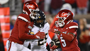 Nov 8, 2025; Louisville, Kentucky, USA;  Louisville Cardinals wide receiver Caullin Lacy (5) returns a kickoff against the California Golden Bears during the second half at L&N Federal Credit Union Stadium. California defeated Louisville 29-26. Mandatory Credit: Jamie Rhodes-Imagn Images