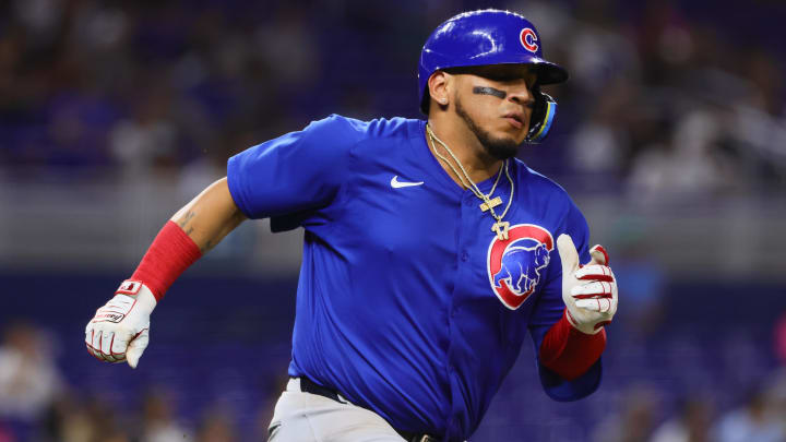 Aug 23, 2024; Miami, Florida, USA; Chicago Cubs third baseman Isaac Paredes (17) runs toward second base after hitting an RBI double against the Miami Marlins during the eighth inning at loanDepot Park.