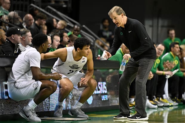 Oregon Ducks head coach Dana Altman gives player instructions during the first half against the Nebraska Cornhuskers.