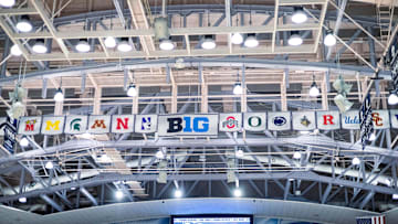 The banners of the Big Ten member schools hang up above.