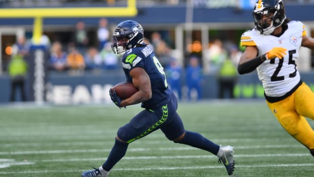 kenneth walker iii rushes against the Steelers