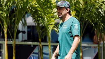 May 5, 2024; Miami Gardens, Florida, USA; Aston Matrin driver Fernando Alonso (14) walks into the F1 Village before the F1 Miami Grand Prix at Miami International Autodrome. Mandatory Credit: Peter Casey-Imagn Images