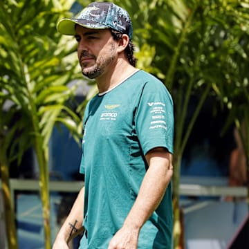 May 5, 2024; Miami Gardens, Florida, USA; Aston Matrin driver Fernando Alonso (14) walks into the F1 Village before the F1 Miami Grand Prix at Miami International Autodrome. Mandatory Credit: Peter Casey-Imagn Images