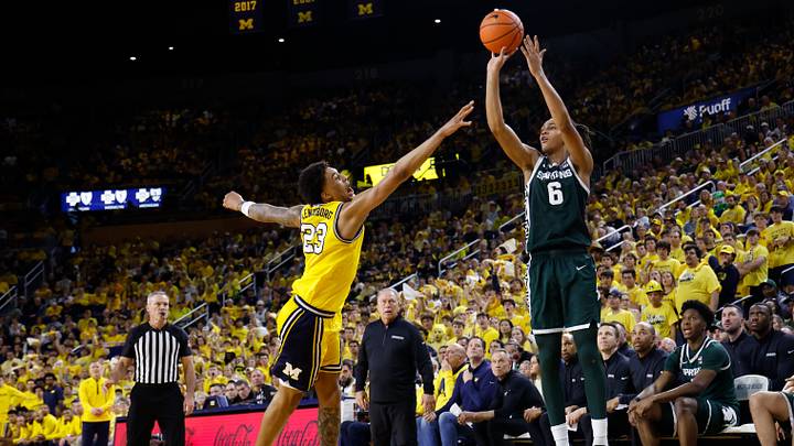 Mar 8, 2026; Ann Arbor, Michigan, USA;  Michigan State Spartans forward Jordan Scott (6) shoots on Michigan Wolverines forward Yaxel Lendeborg (23) in the second half at Crisler Center. Mandatory Credit: Rick Osentoski-Imagn Images