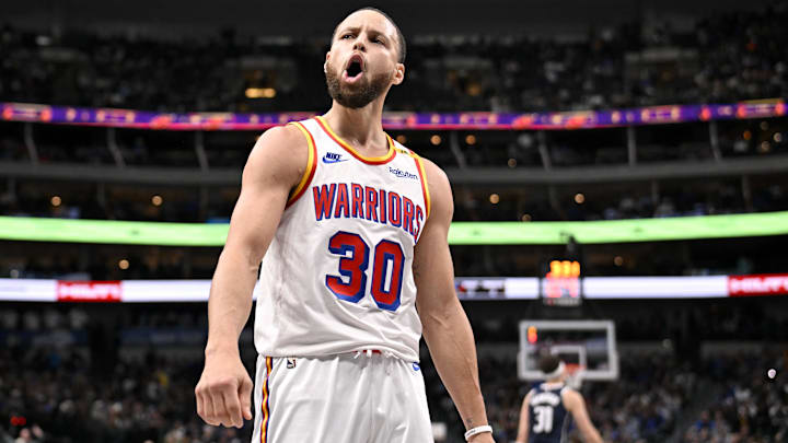 Feb 12, 2025; Dallas, Texas, USA; Golden State Warriors guard Stephen Curry (30) celebrates after he makes a three point shot over Dallas Mavericks guard Klay Thompson (31) to give the Warriors the lead during the fourth quarter at the American Airlines Center. Mandatory Credit: Jerome Miron-Imagn Images