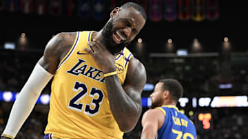 Los Angeles Lakers forward LeBron James (23) reacts to a play against the Golden State Warriors in the third quarter of their preseason game at T-Mobile Arena.