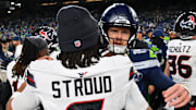 Oct 20, 2025; Seattle, Washington, USA; Houston Texans quarterback C.J. Stroud (7) and Seattle Seahawks quarterback Sam Darnold (14) greet each other after the game at Lumen Field. Mandatory Credit: Steven Bisig-Imagn Images
