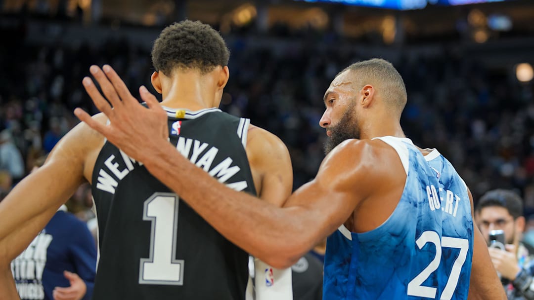 Feb 27, 2024; Minneapolis, Minnesota, USA; Minnesota Timberwolves center Rudy Gobert (27) and San Antonio Spurs center Victor Wembanyama (1) talk after the game at Target Center. Mandatory Credit: Brad Rempel-Imagn Images