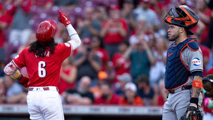 Cincinnati Reds second baseman Jonathan India (6) gestures as he crosses home plate after hitting a solo home run as Houston Astros catcher Victor Caratini (17) looks on in the first inning of the MLB game between the Cincinnati Reds and Houston Astros at Great American Ball Park in Cincinnati on Wednesday, Sept. 4, 2024.