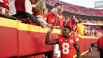 Oct 12, 2023; Kansas City, Missouri, USA; Kansas City Chiefs wide receiver Justyn Ross (8) celebrates with fans while leaving the game after the win over the Los Angeles Chargers at GEHA Field at Arrowhead Stadium. Mandatory Credit: Denny Medley-Imagn Images