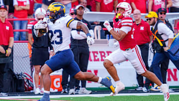  Michigan Wolverines running back Jordan Marshall runs for a touchdown against Nebraska Cornhuskers defensive back Donovan Jones during the third quarter.