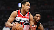 Dec 3, 2024; Cleveland, Ohio, USA; Washington Wizards guard Malcolm Brogdon (15) drives to the basket against Cleveland Cavaliers guard Donovan Mitchell (45) during the first quarter at Rocket Mortgage FieldHouse. Mandatory Credit: Ken Blaze-Imagn Images
