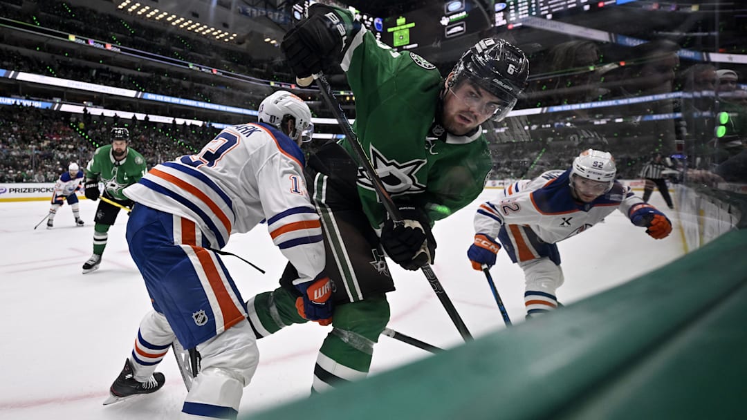 May 29, 2025; Dallas, Texas, USA; Edmonton Oilers center Mattias Janmark (13) checks Dallas Stars defenseman Lian Bichsel (6) during the second period in game five of the Western Conference Final of the 2025 Stanley Cup Playoffs at American Airlines Center. Mandatory Credit: Jerome Miron-Imagn Images