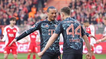 Leroy Sane celebrating with Josip Stanisic after scoring for Bayern Munich against Union Berlin.