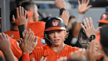 Mar 29, 2025; Toronto, Ontario, CAN; Baltimore Orioles shortstop Jackson Holliday (7) celebrates with team mates in the dugout after scoring against the Toronto Blue Jays in the fourth inning at Rogers Centre. Mandatory Credit: Dan Hamilton-Imagn Images