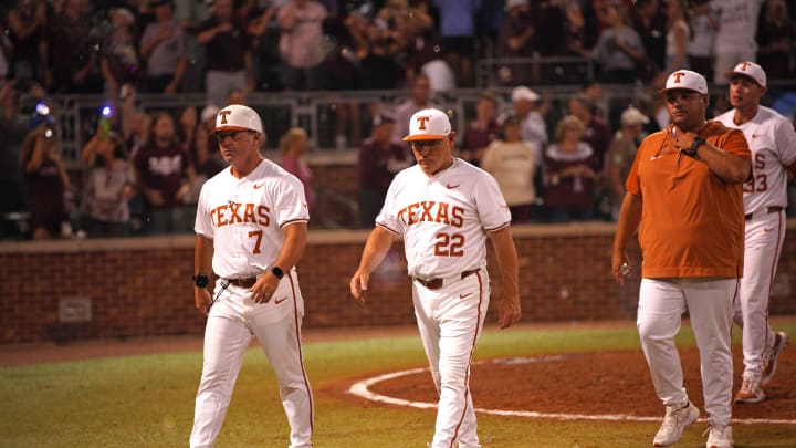 June 1, 2024; College Station, TX, USA; Texas Longhorns head coach David Pierce (22) and assistant coach Steve Rodriguez (7) leave the field following a 2-4 loss to the Texas A&M Aggies in the second round of the NCAA baseball College Station Regional at Olsen Field College Station. Mandatory Credit: Dustin Safranek-USA TODAY Sports