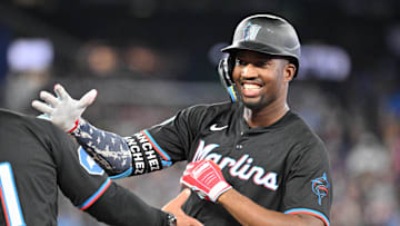 Sep 28, 2024; Toronto, Ontario, CAN;   Miami Marlins right fielder Jesus Sanchez (12) celebrates after hitting a single against the Toronto Blue Jays in the eighth inning at Rogers Centre. Mandatory Credit: Dan Hamilton-Imagn Images