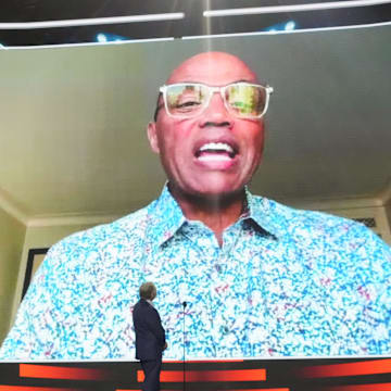 Charles Barkley speaks with NHL Commissioner Gary Bettman before announcing the sixth overall pick of the 2025 NHL Draft 