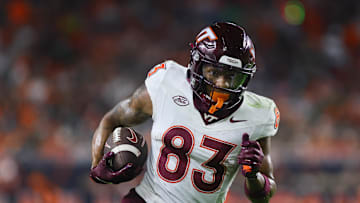 Sep 27, 2024; Miami Gardens, Florida, USA; Virginia Tech Hokies wide receiver Jaylin Lane (83) run with the football for a touchdown against the Miami Hurricanes during the second quarter at Hard Rock Stadium. Mandatory Credit: Sam Navarro-Imagn Images