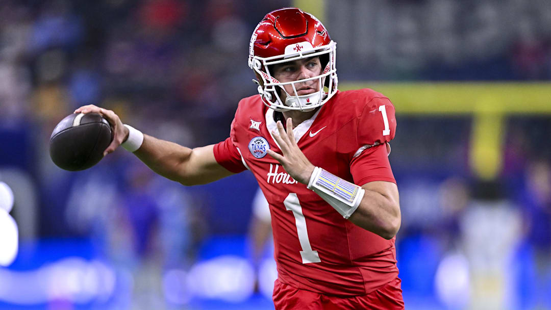 Dec 27, 2025; Houston, TX, USA; Houston Cougars quarterback Conner Weigman (1) warms up prior to the game against the Louisiana State Tigers at NRG Stadium. Mandatory Credit: Maria Lysaker-Imagn Images 