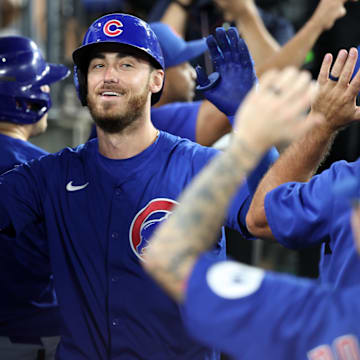 Sep 11, 2024; Los Angeles, California, USA;  Chicago Cubs right fielder Cody Bellinger (24) is greeted in the dugout after hitting a 3-run home run during the fifth inning against the Los Angeles Dodgers at Dodger Stadium