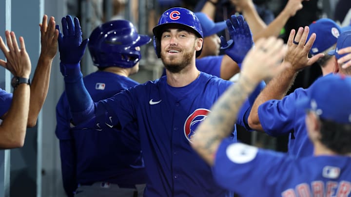 Sep 11, 2024; Los Angeles, California, USA;  Chicago Cubs right fielder Cody Bellinger (24) is greeted in the dugout after hitting a 3-run home run during the fifth inning against the Los Angeles Dodgers at Dodger Stadium