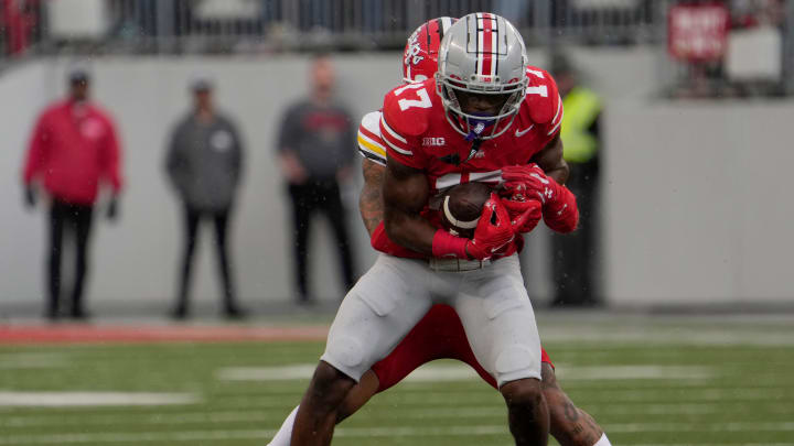 Oct. 7, 2023; Columbus, Oh., USA; 
Ohio State Buckeyes wide receiver Carnell Tate is tackled by Maryland Terrapins defensive back Gavin Gibson (26) during the second half of Saturday's NCAA Division I football game at Ohio Stadium.