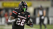 Oct 25, 2025; Louisville, Kentucky, USA;  Louisville Cardinals running back Keyjuan Brown (22) runs the ball for a touchdown against the Boston College Eagles during the second half at L&N Federal Credit Union Stadium.  Mandatory Credit: Jamie Rhodes-Imagn Images