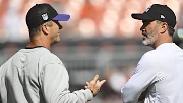 Oct 1, 2023; Cleveland, Ohio, USA; Baltimore Ravens head coach John Harbaugh (left) talks with Cleveland Browns head coach Kevin Stefanski before a game at Cleveland Browns Stadium. Mandatory Credit: David Richard-Imagn Images