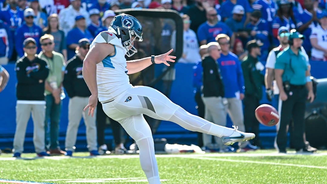 Oct 20, 2024; Orchard Park, New York, USA; Tennessee Titans punter Ryan Stonehouse (4) makes contact with the ball in the fourth quarter against the Buffalo Bills at Highmark Stadium. 