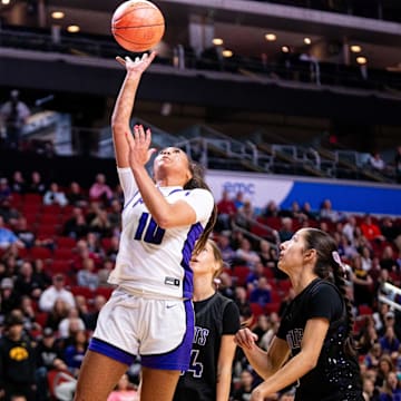 Johnston's Jenica Lewis (10) takes a shot at the basket on Monday, March 3, 2025, at Wells Fargo Arena.
