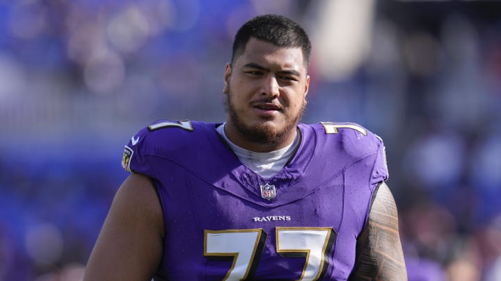 Nov 12, 2023; Baltimore, Maryland, USA;  Baltimore Ravens offensive tackle Daniel Faalele (77) looks on before a game against the Cleveland Browns at M&T Bank Stadium. Mandatory Credit: Jessica Rapfogel-USA TODAY Sports