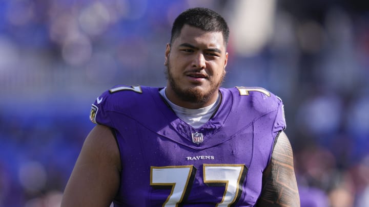 Nov 12, 2023; Baltimore, Maryland, USA;  Baltimore Ravens offensive tackle Daniel Faalele (77) looks on before a game against the Cleveland Browns at M&T Bank Stadium. Mandatory Credit: Jessica Rapfogel-USA TODAY Sports