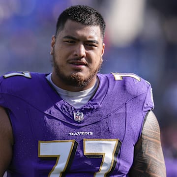 Nov 12, 2023; Baltimore, Maryland, USA;  Baltimore Ravens offensive tackle Daniel Faalele (77) looks on before a game against the Cleveland Browns at M&T Bank Stadium. Mandatory Credit: Jessica Rapfogel-Imagn Images