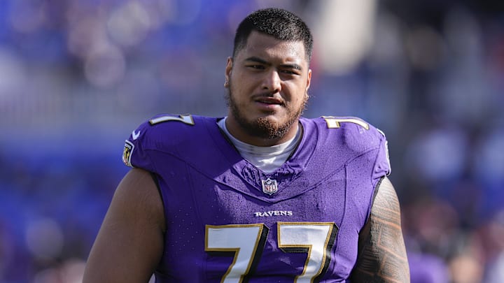 Nov 12, 2023; Baltimore, Maryland, USA;  Baltimore Ravens offensive tackle Daniel Faalele (77) looks on before a game against the Cleveland Browns at M&T Bank Stadium. Mandatory Credit: Jessica Rapfogel-Imagn Images