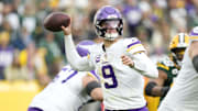 Nov 23, 2025; Green Bay, Wisconsin, USA; Minnesota Vikings quarterback J.J. McCarthy (9) throws the ball against the Green Bay Packers during the second half at Lambeau Field.