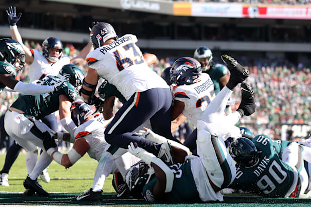 Denver Broncos running back J.K. Dobbins (27) scores a touchdown against the Philadelphia Eagles.