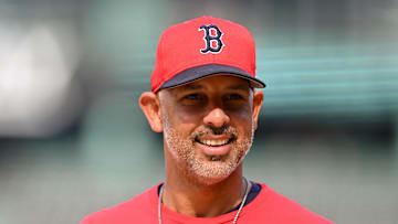 Boston Red Sox manager Alex Cora walks onto the field before a game against the Texas Rangers at Fenway Park.