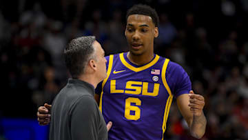 Mar 12, 2025; Nashville, TN, USA; LSU Tigers forward Robert Miller III (6) talks with head coach Matt McMahon during a break against the Mississippi State Bulldogs during the first half at Bridgestone Arena. Mandatory Credit: Steve Roberts-Imagn Images