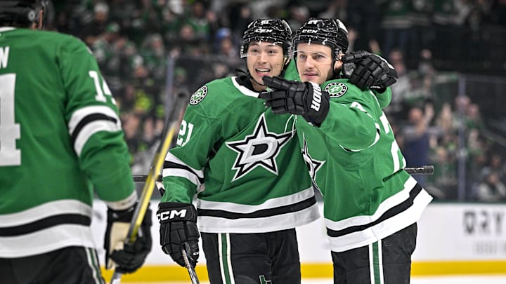 Dec 14, 2024; Dallas, Texas, USA; Dallas Stars left wing Jason Robertson (21) and center Roope Hintz (24) celebrates a goal scored by Robertson against the St. Louis Blues during the second period at American Airlines Center. Mandatory Credit: Jerome Miron-Imagn Images