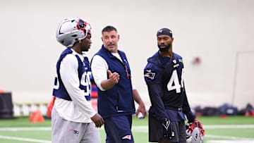 Jun 10, 2025; Foxborough, MA, USA; New England Patriots head coach Mike Vrabel speaks to defensive end Keion White (99) and linebacker K'Lavon Chaisson (44) after minicamp held in the WIN Field House at Gillette Stadium. Mandatory Credit: Eric Canha-Imagn Images