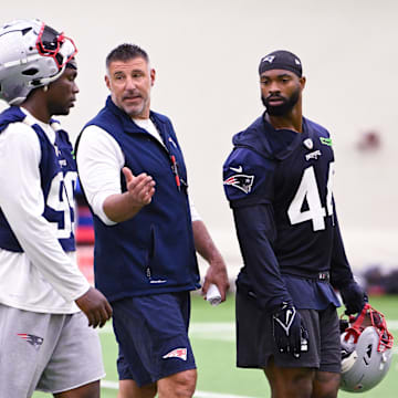 Jun 10, 2025; Foxborough, MA, USA; New England Patriots head coach Mike Vrabel speaks to defensive end Keion White (99) and linebacker K'Lavon Chaisson (44) after minicamp held in the WIN Field House at Gillette Stadium. Mandatory Credit: Eric Canha-Imagn Images