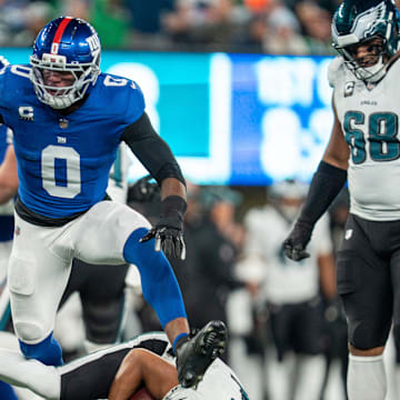 New York Giants Brian Burns sacks Philadelphia Eagles quarterback Jalen Hurts (1) during a Thursday Night Football game between the New York Giants and the Philadelphia Eagles at MetLife Stadium in East Rutherford on Oct. 9, 2025.