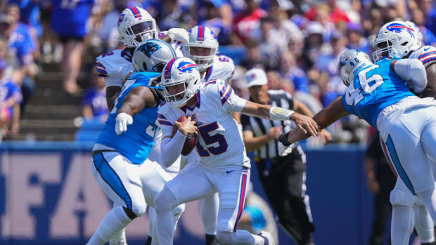 Buffalo Bills quarterback Ben DiNucci (15) runs with the ball against the Carolina Panthers during the first half