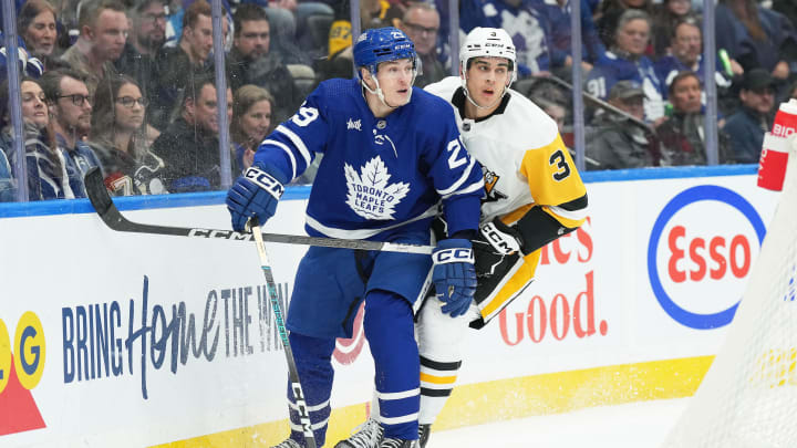 Apr 8, 2024; Toronto, Ontario, CAN; Pittsburgh Penguins defenseman Jack St. Ivany (3) battles behind the net with Toronto Maple Leafs right wing Pontus Holmberg (29) during the third period at Scotiabank Arena. Mandatory Credit: Nick Turchiaro-USA TODAY Sports