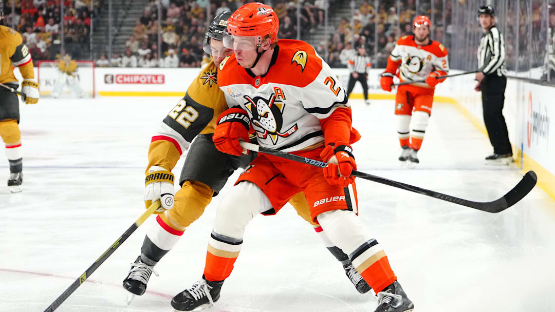 May 4, 2026; Las Vegas, Nevada, USA; Vegas Golden Knights right wing Cole Smith (22) checks Anaheim Ducks defenseman Jackson LaCombe (2) during the third period of game one of the second round of the 2026 Stanley Cup Playoffs at T-Mobile Arena. Mandatory Credit: Stephen R. Sylvanie-Imagn Images
