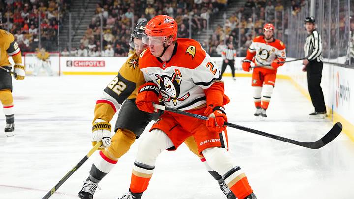 May 4, 2026; Las Vegas, Nevada, USA; Vegas Golden Knights right wing Cole Smith (22) checks Anaheim Ducks defenseman Jackson LaCombe (2) during the third period of game one of the second round of the 2026 Stanley Cup Playoffs at T-Mobile Arena. Mandatory Credit: Stephen R. Sylvanie-Imagn Images